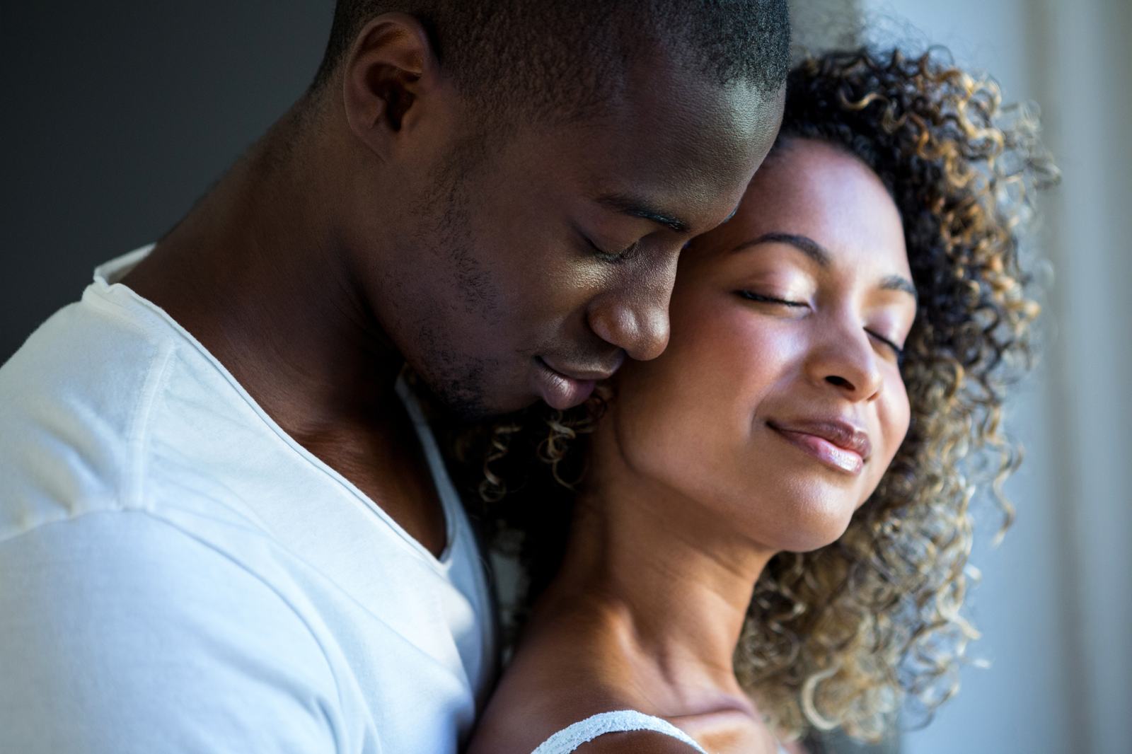 A Black couple embracing, boutique matchmaking for Black professionals by The Broom List